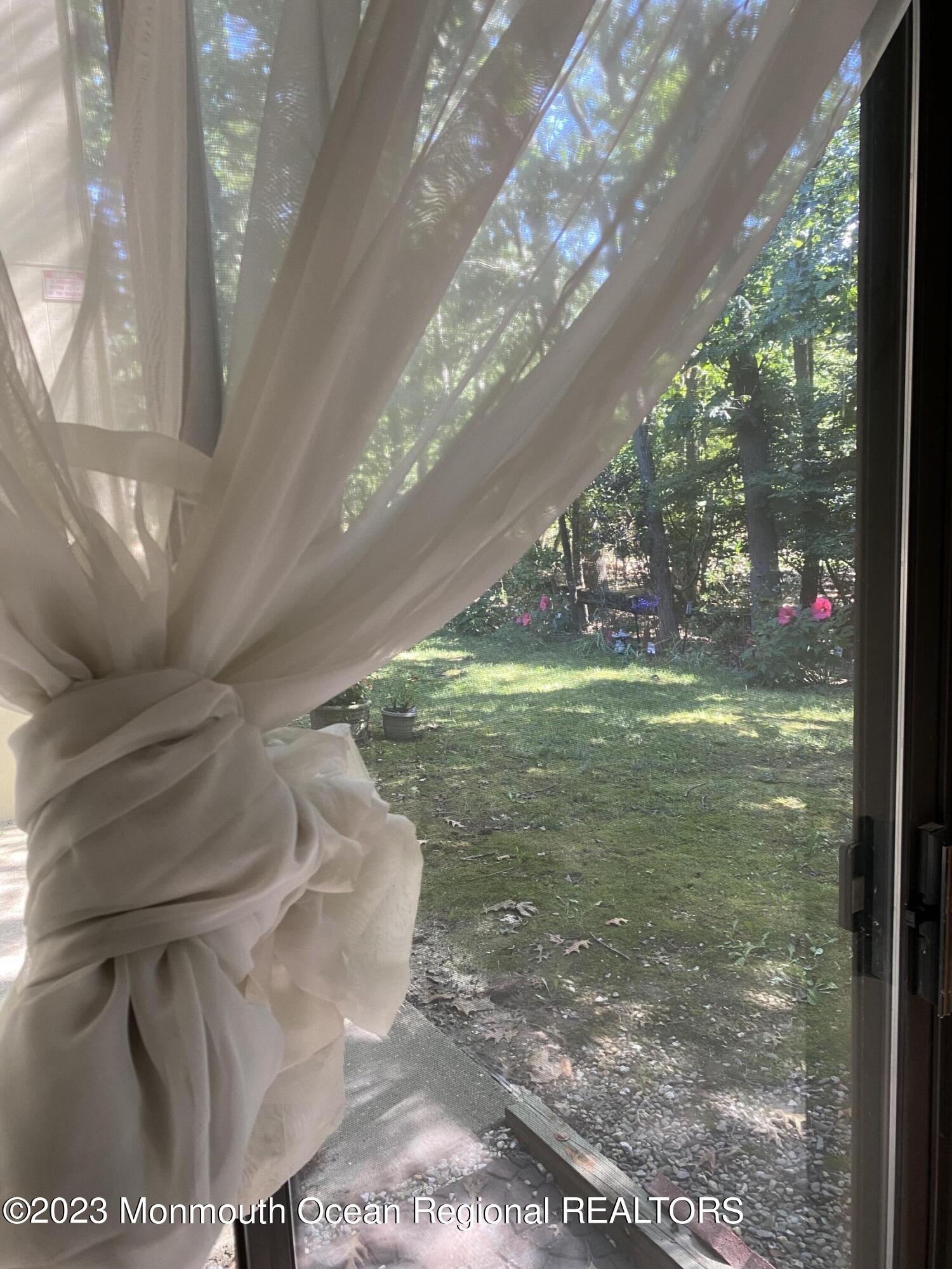 91 Arrowood Road, Unit E Manalapan, NJ 07726 - Photo 3 of 8 a view of a porch