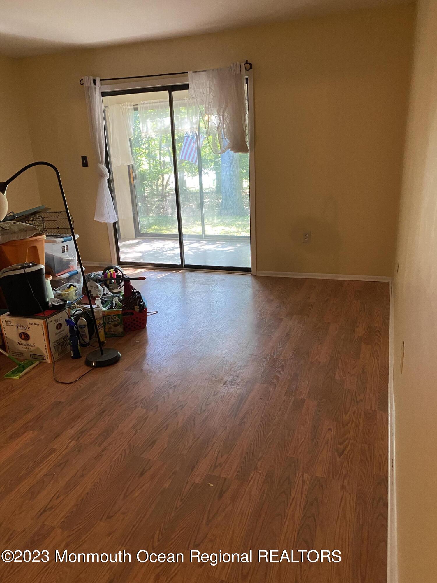 91 Arrowood Road, Unit E Manalapan, NJ 07726 - Photo 4 of 8 a view of a room with gym equipment