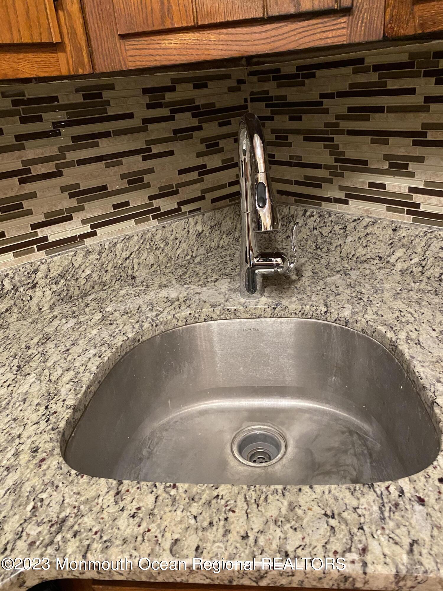 91 Arrowood Road, Unit E Manalapan, NJ 07726 - Photo 5 of 8 a view of a sink