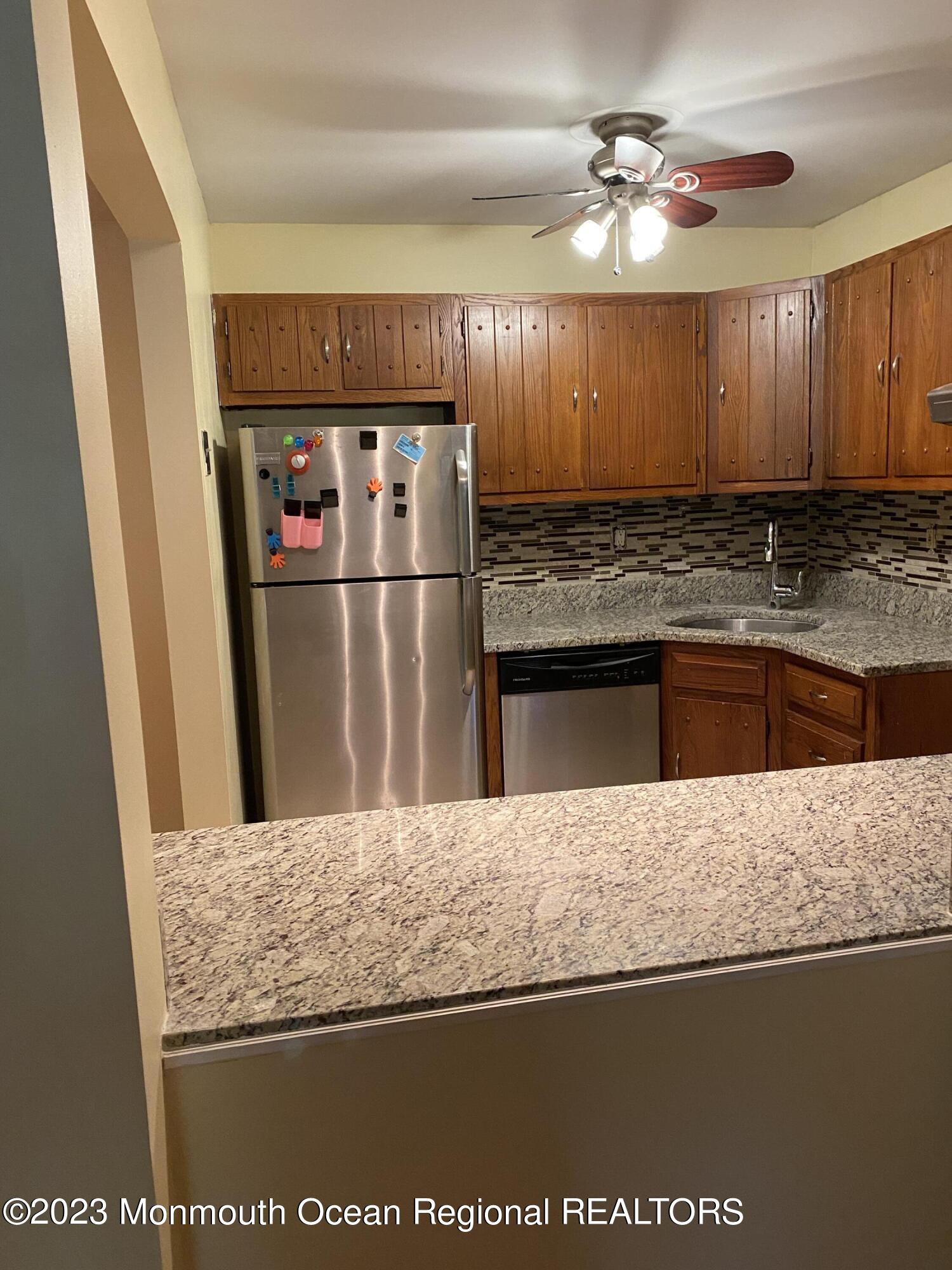 91 Arrowood Road, Unit E Manalapan, NJ 07726 - Photo 6 of 8 a view of a counter top space