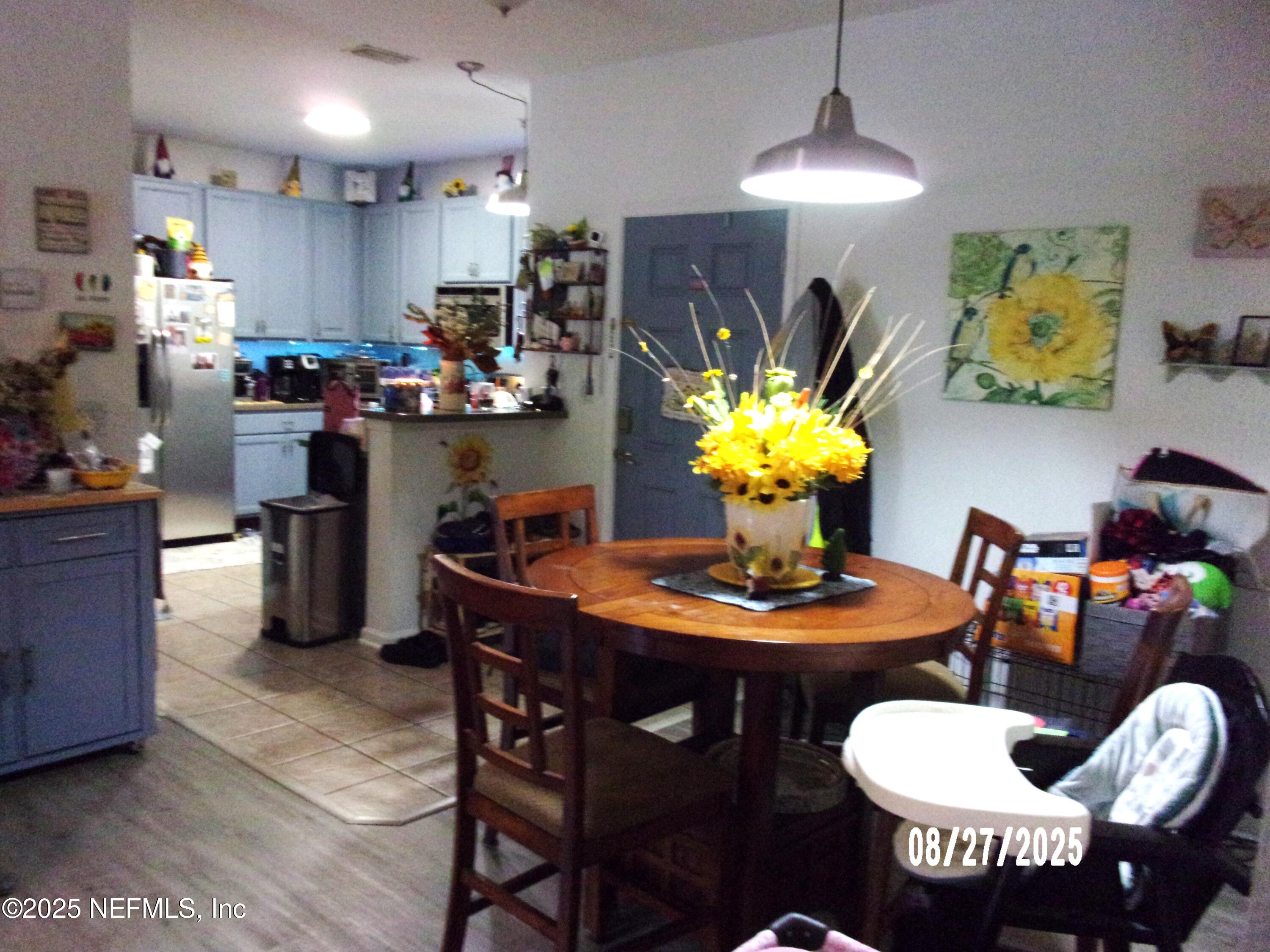 2871 Golden Lake Loop St. Augustine, FL 32084 - Photo 3 of 10 a kitchen with a table and chairs in it