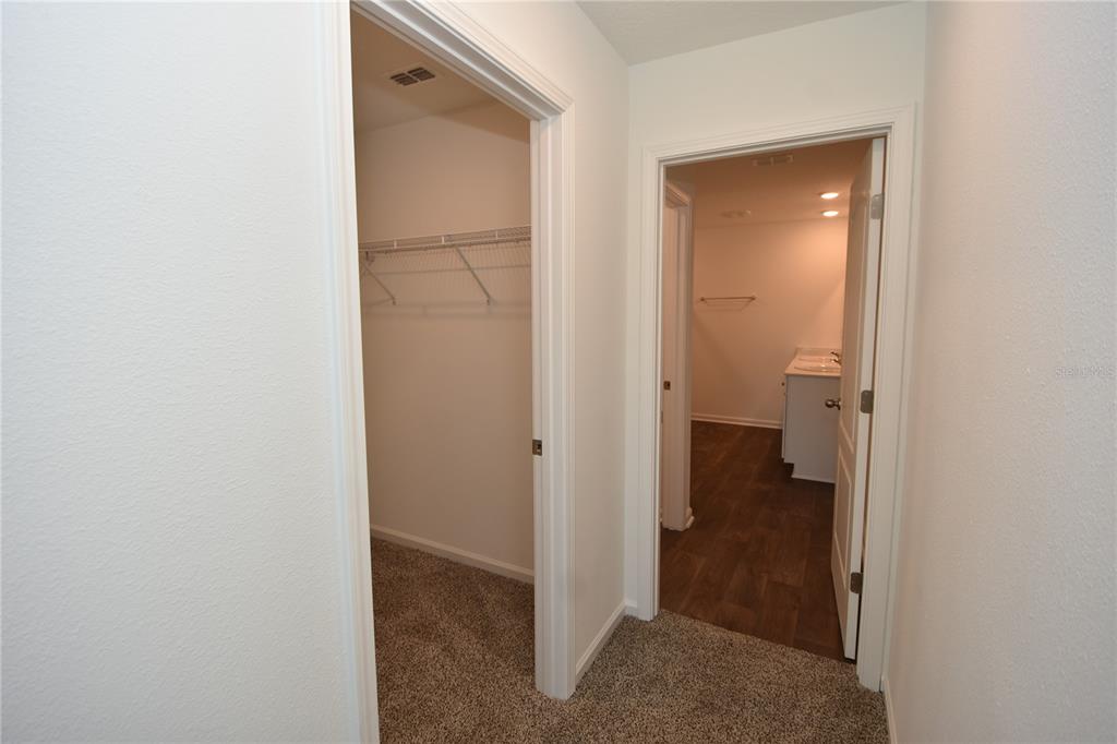 9 Springwood Drive Palm Coast, FL 32137 - Photo 17 of 29 a view of a bathroom from a hallway