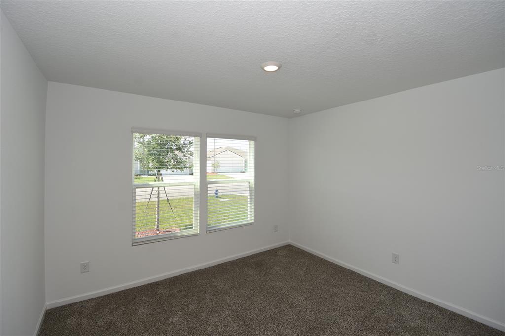 9 Springwood Drive Palm Coast, FL 32137 - Photo 22 of 29 an empty room with a window