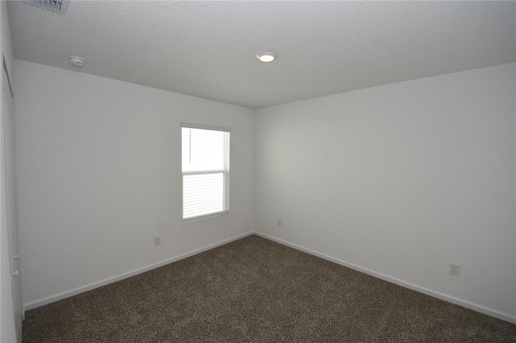 9 Springwood Drive Palm Coast, FL 32137 - Photo 25 of 29 an empty room with a window