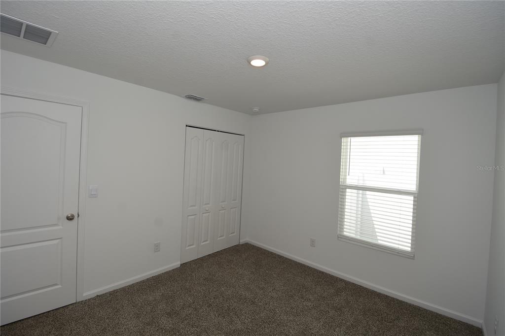 9 Springwood Drive Palm Coast, FL 32137 - Photo 26 of 29 an empty room with a window