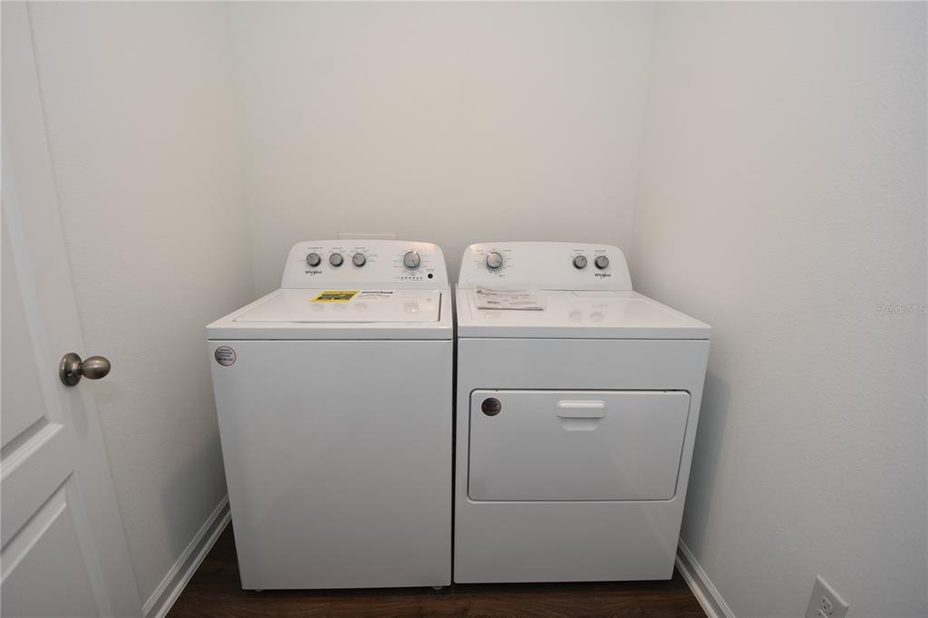 9 Springwood Drive Palm Coast, FL 32137 - Photo 28 of 29 a utility room with dryer and washer