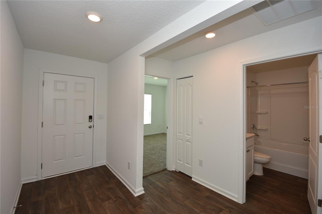 9 Springwood Drive Palm Coast, FL 32137 - Photo 4 of 29 wooden floor & closet in a room