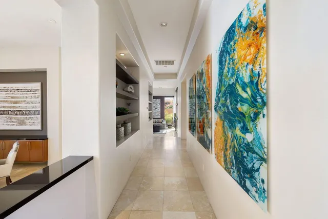 a kitchen with stainless steel appliances kitchen island granite countertop a sink and counter space