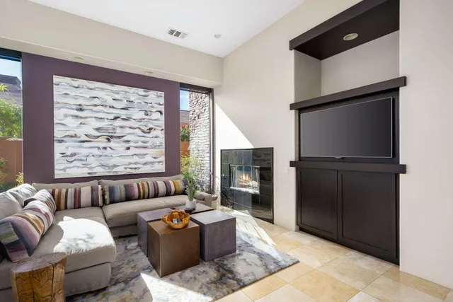 a kitchen with stainless steel appliances granite countertop a sink and a refrigerator