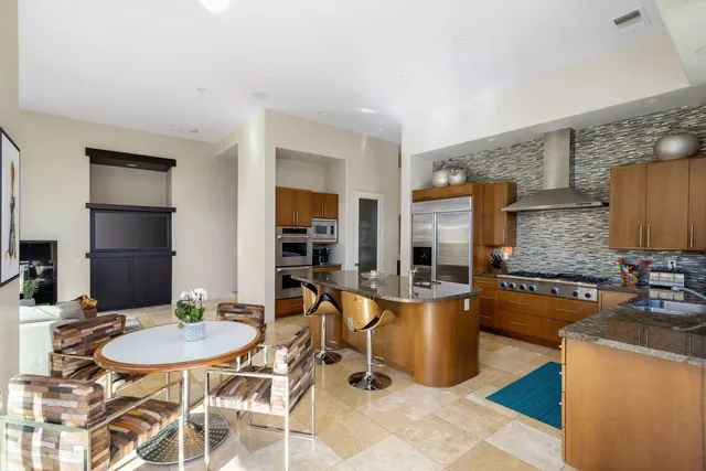 a view of a backyard with sitting area