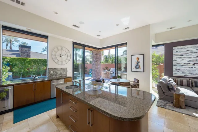 a view of a patio with couches and potted plants