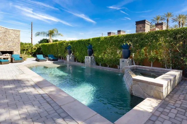 a bathroom with a tub and shower
