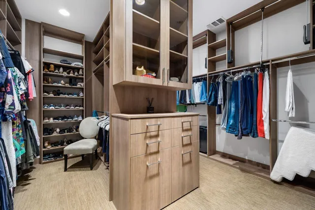 a kitchen with stainless steel appliances granite countertop a sink and a refrigerator