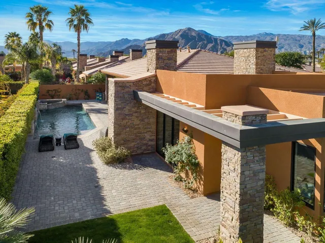 a view of a house with sitting area and furniture