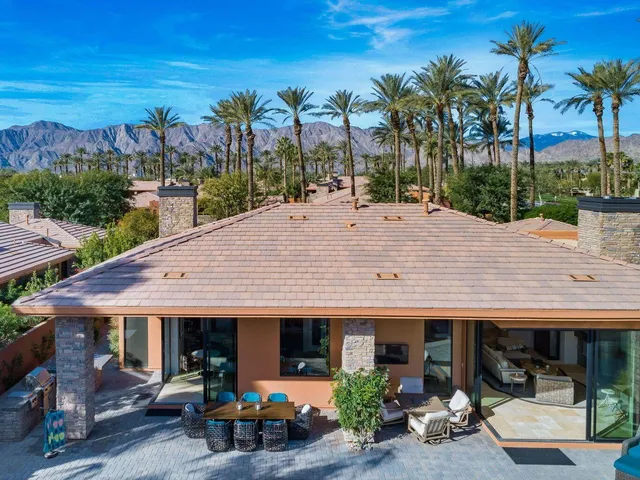a view of a house with sitting area and furniture