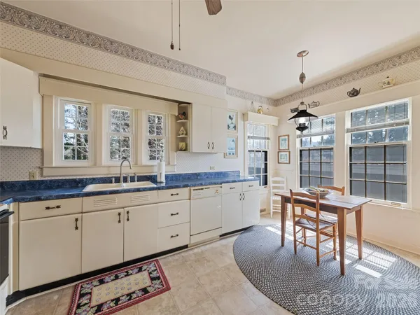 a view of a livingroom with furniture and a window