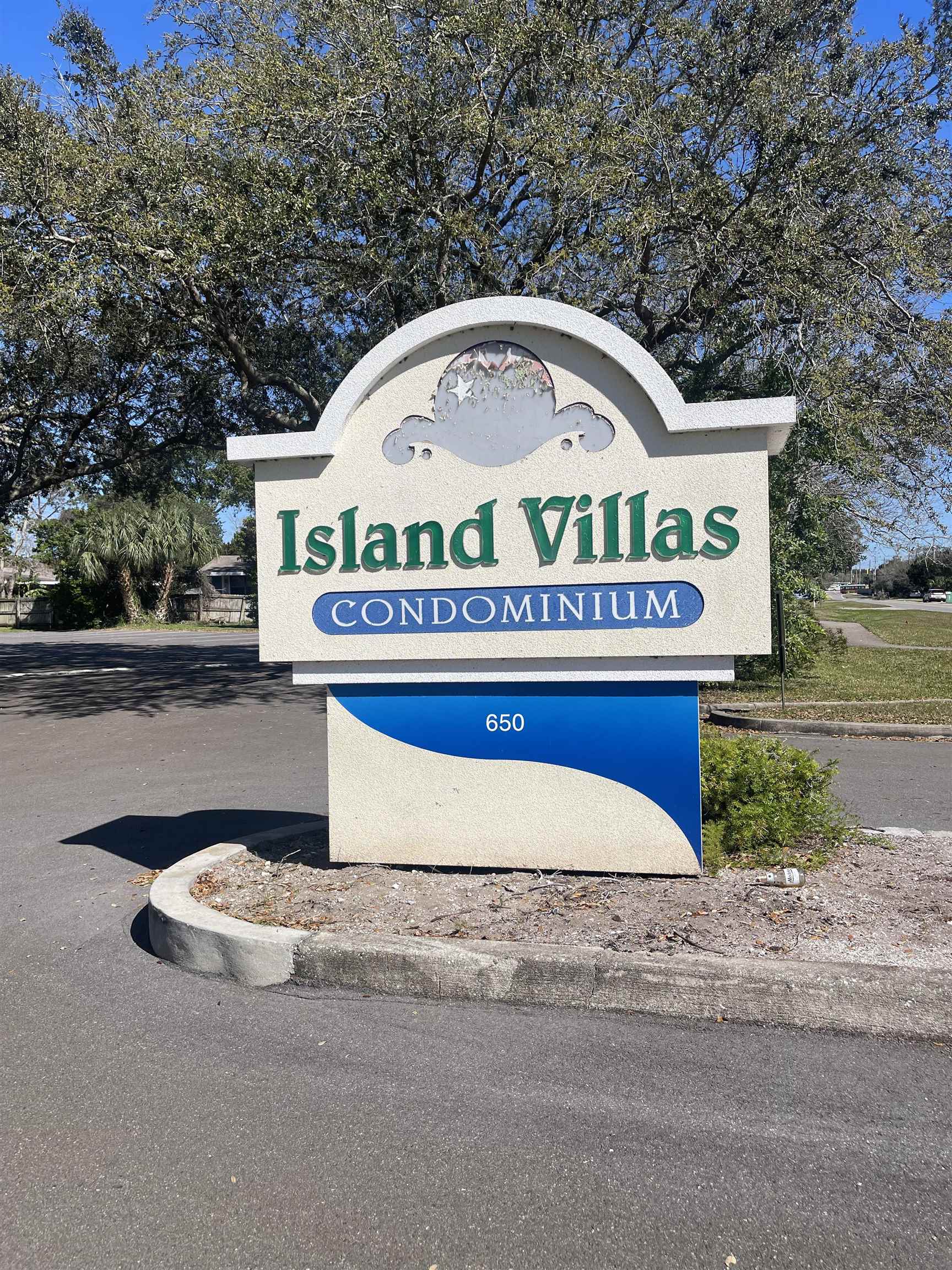 650 West Pope Road, Unit 276 St. Augustine, FL 32080 - Photo 1 of 15 a view of swimming pool with a yard and large tree