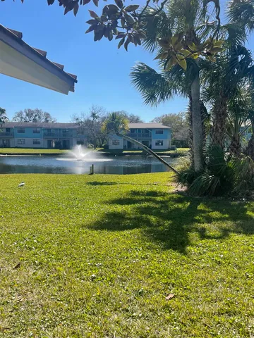 a view of a swimming pool with an ocean view