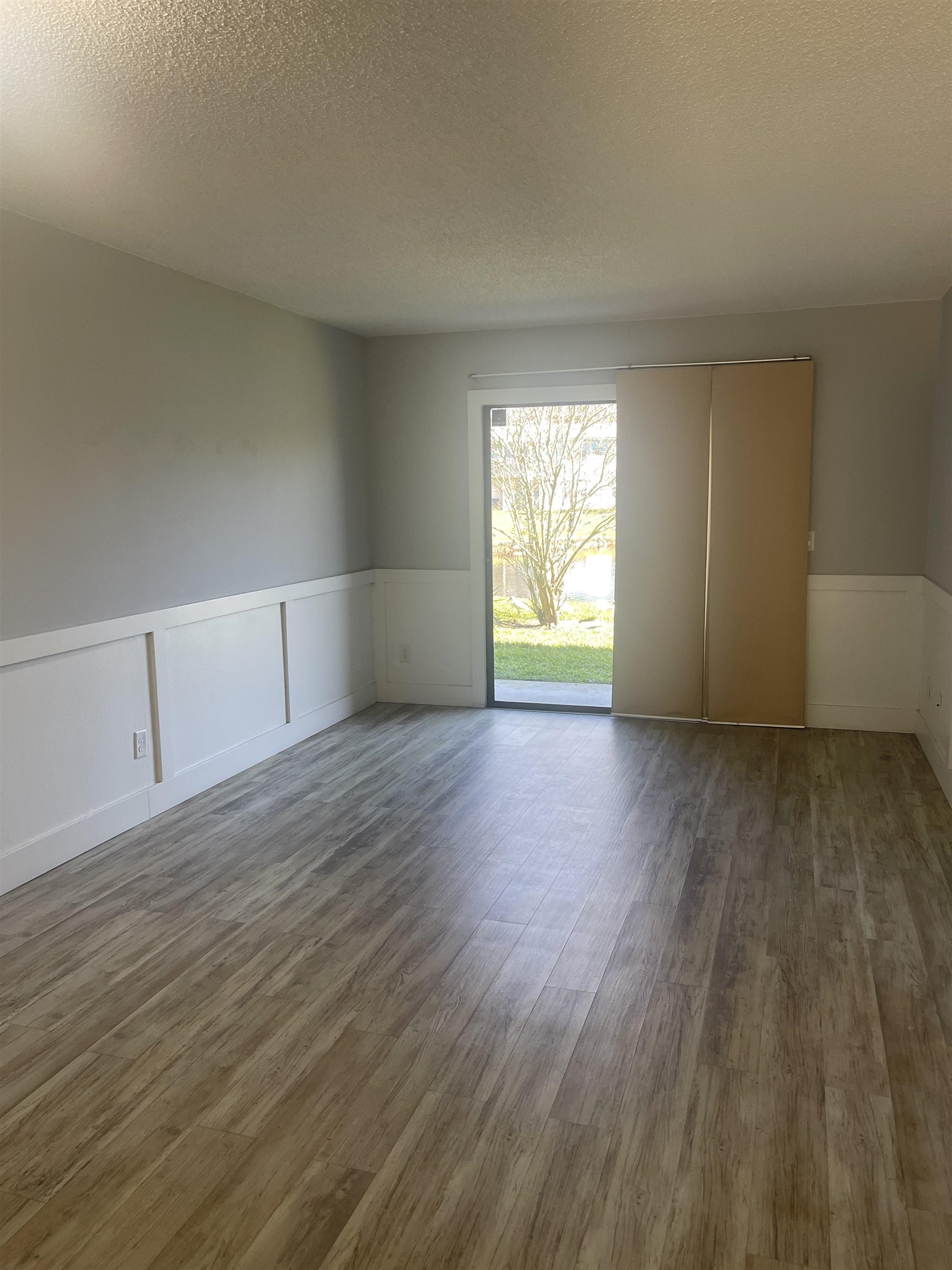 650 West Pope Road, Unit 276 St. Augustine, FL 32080 - Photo 8 of 15 a view of empty room with wooden floor and fan