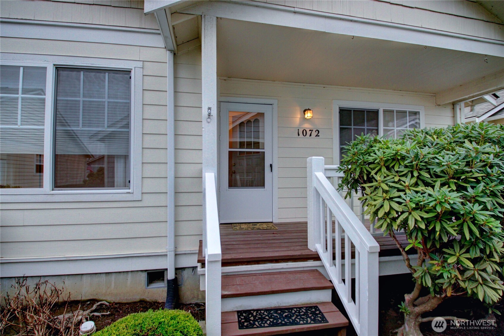 1072 Sinclair Way, Unit 56 Burlington, WA 98233 - Photo 4 of 29 a view of a house with a yard