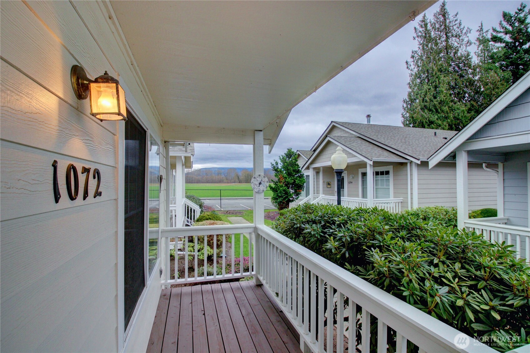 1072 Sinclair Way, Unit 56 Burlington, WA 98233 - Photo 5 of 29 a view of a house with brick walls