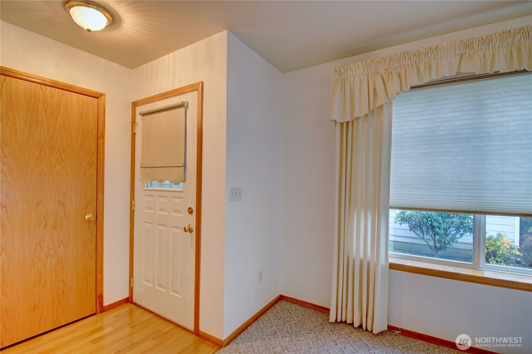 1072 Sinclair Way, Unit 56 Burlington, WA 98233 - Photo 6 of 29 a view of front door with wooden floor