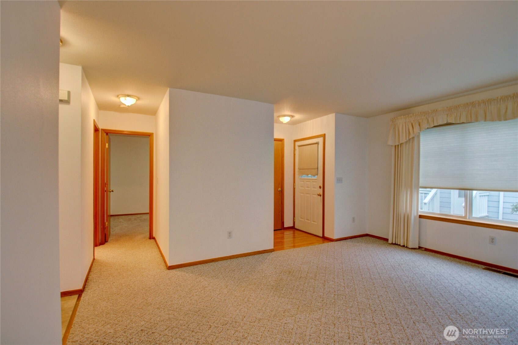 1072 Sinclair Way, Unit 56 Burlington, WA 98233 - Photo 9 of 29 a view of an empty room with a window