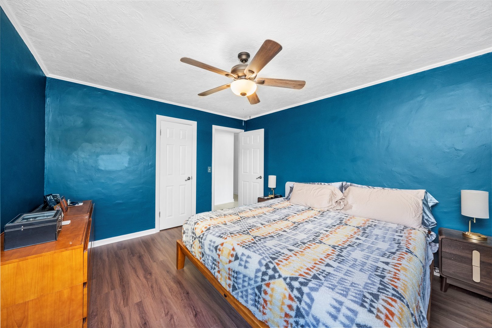 1212 Grandview Avenue Lockport, IL 60441 - Photo 12 of 38 a bedroom with a bed and a chandelier