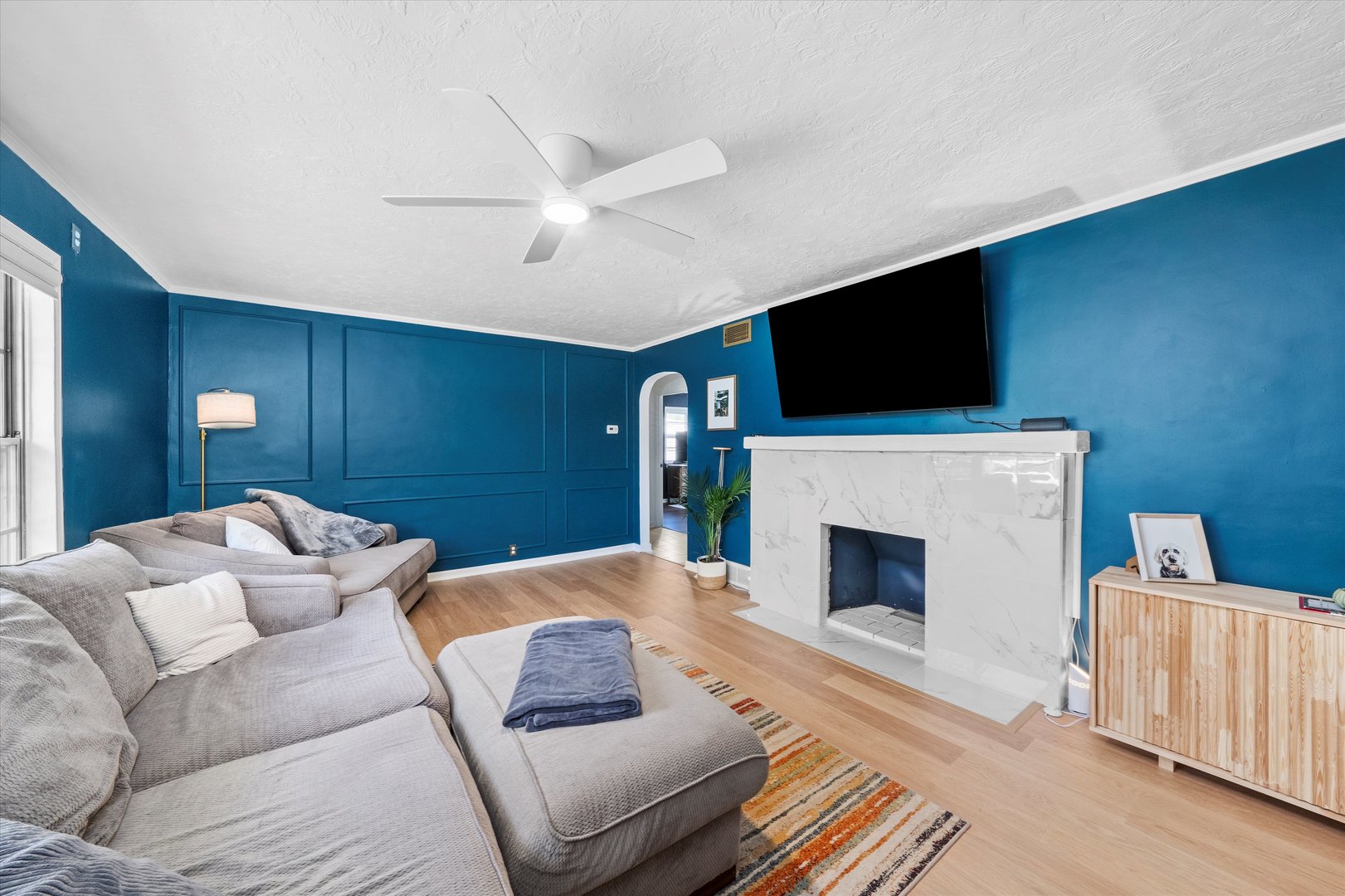 1212 Grandview Avenue Lockport, IL 60441 - Photo 2 of 38 a living room with furniture a flat screen tv and a fireplace