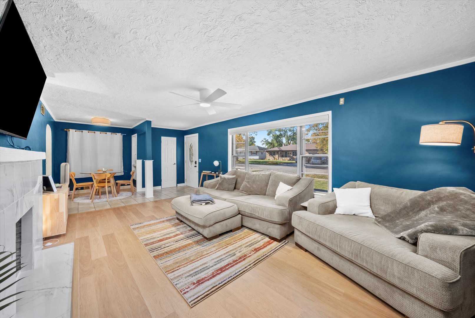 1212 Grandview Avenue Lockport, IL 60441 - Photo 4 of 38 a living room with furniture and a flat screen tv