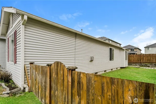 a view of a house with a backyard