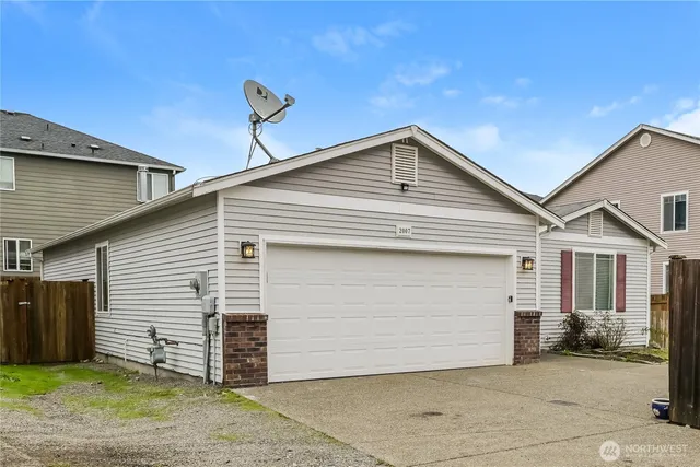 a front view of a house with a garage