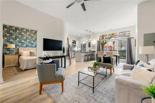 a living room with furniture and a flat screen tv