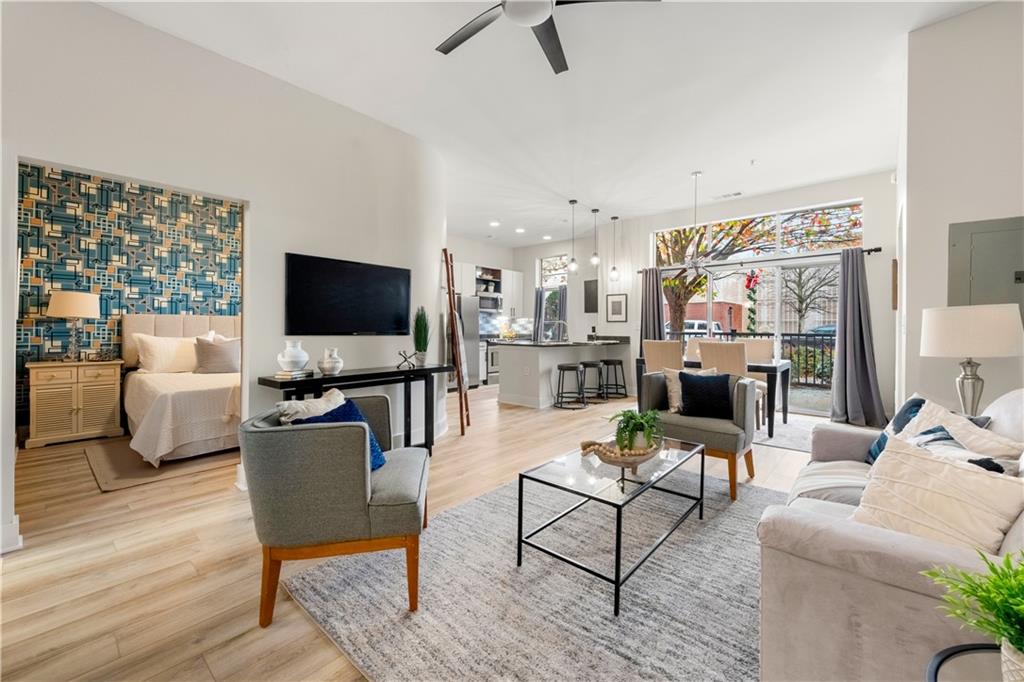 a living room with furniture and a flat screen tv