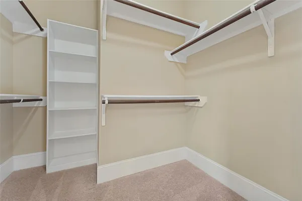 a view of an empty walk in closet