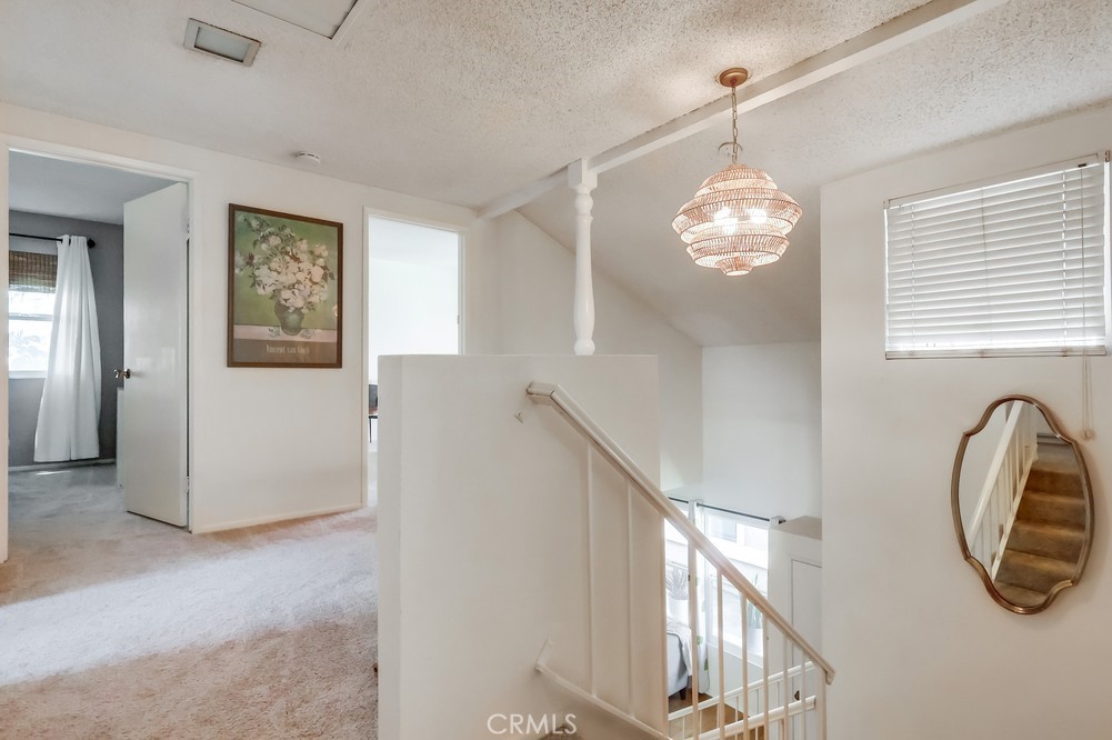 1749 Compromise Line Road Glendora, CA 91740 - Photo 21 of 44 a view of a hallway with windows and chandelier