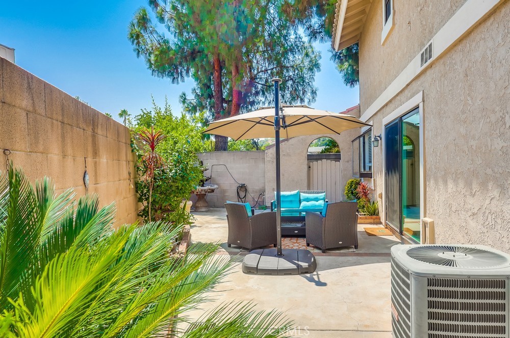 1749 Compromise Line Road Glendora, CA 91740 - Photo 42 of 44 a view of a patio with a table and chairs under an umbrella
