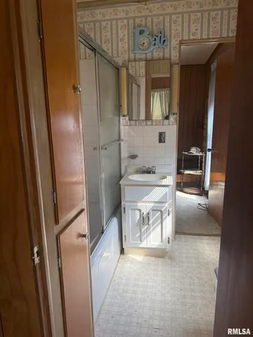 a bathroom with a sink and a shower
