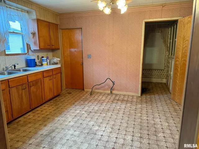 a view of an empty room with a fireplace