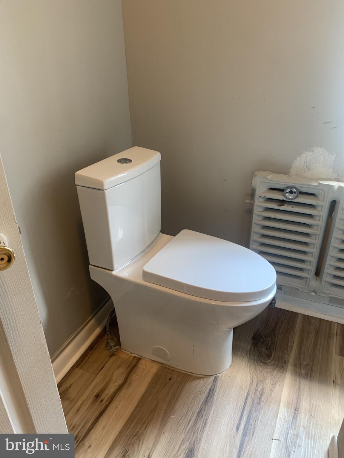 416 Spring Street Reading, PA 19601 - Photo 8 of 11 a white toilet sitting next to a bathroom sink