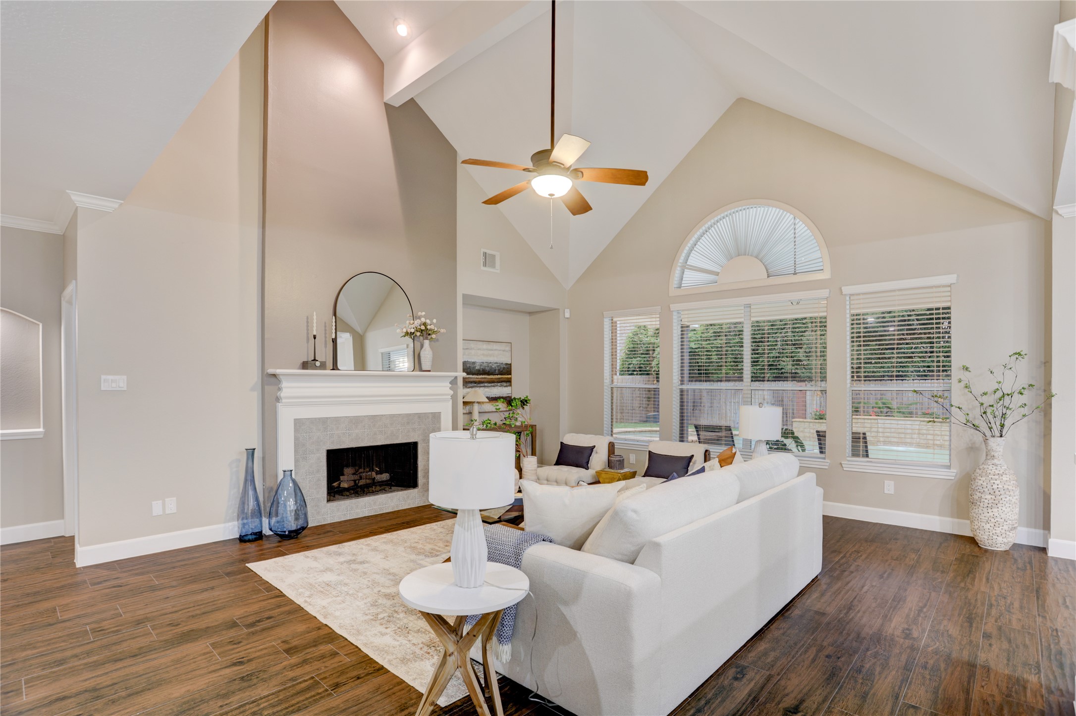 24418 Falcon Point Drive Katy, TX 77494 - Photo 6 of 40 a living room with furniture a fireplace and a large window