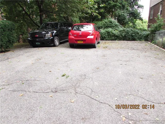 a car parked in parking area of a house