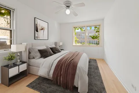 a bedroom with bed and a window