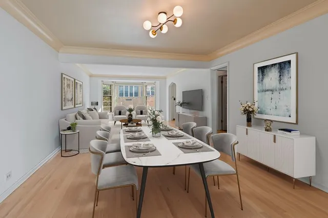 a view of a dining room with furniture and wooden floor