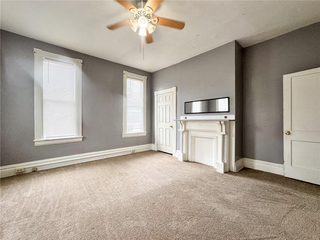 411 Cherry Street, Unit 1 Butler, PA 16001 - Photo 13 of 16 an empty room with windows and cabinet
