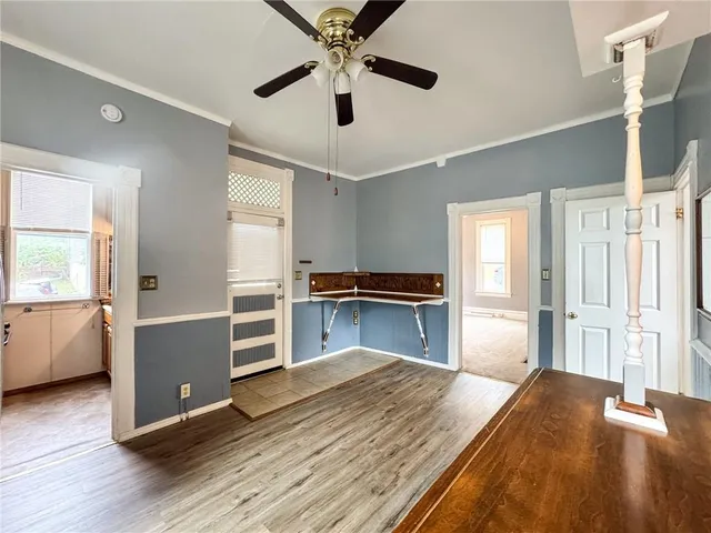 a kitchen with a refrigerator and a stove top oven