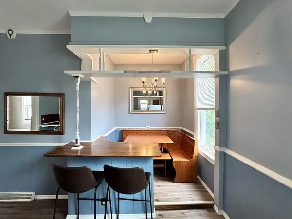 a room with chairs and window