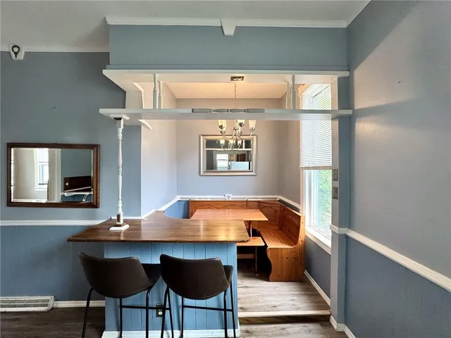 a room with chairs and window