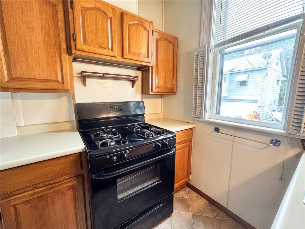 411 Cherry Street, Unit 1 Butler, PA 16001 - Photo 7 of 16 a stove top oven sitting inside of a kitchen