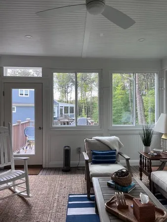 a living room with furniture and window